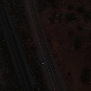 Aerial View of a Car on the Open Road