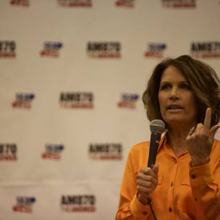 Woman Shows Peace Sign at Politicon 2015