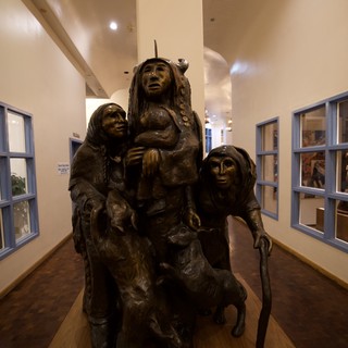 Bronze Sculpture of Native American Women and Wolf