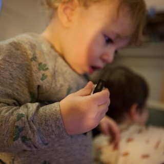 Young Child Eating Pizza in Cozy Home Setting