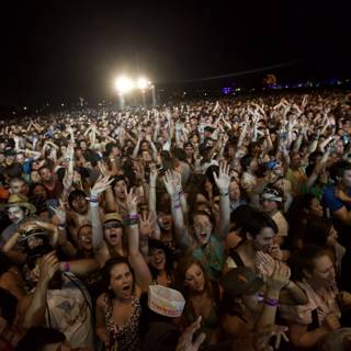 Hands Up in the Night Sky at Coachella