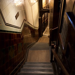 Elegant Victorian-Era Stairwell with Ornate Tile Work