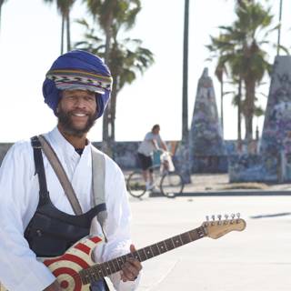 Turbaned Guitarist Under The Palm Tree