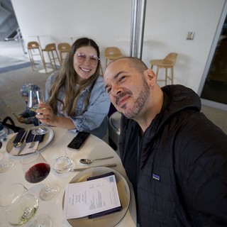 Couple Enjoying Wine Tasting at Modern Restaurant