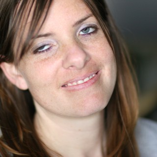 Candid Portrait of Smiling Young Woman Indoors