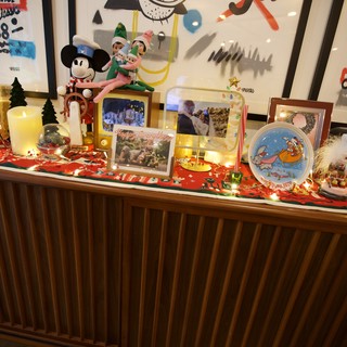 Festive Christmas Display with Disney Decorations and Family Photos