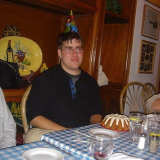 Birthday Celebration with Party Hat at Restaurant