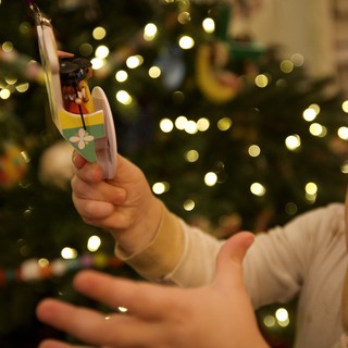 Child's Joyful Wonder at Christmas Tree Ornament