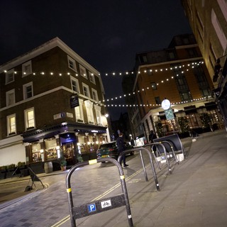 Evening Street Scene with Festive Lights in London
