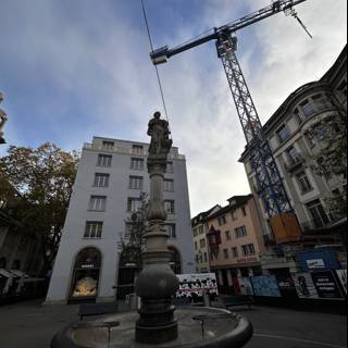 Cityscape Fountain with Construction Crane