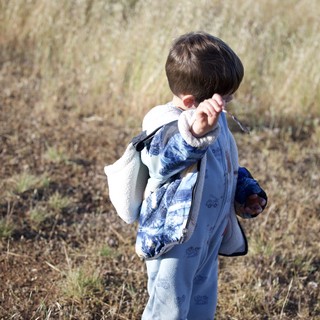 Young Explorer Ventures Through Dry Grassland Field