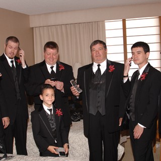 Groomsmen Distracted by Phones Before Wedding Ceremony