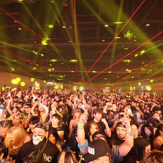 Massive Crowd Erupts Under Laser Light Show