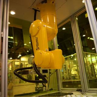 Yellow Robot in a Manufacturing Machine