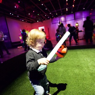 Child with Light Saber at Baby Rave Event
