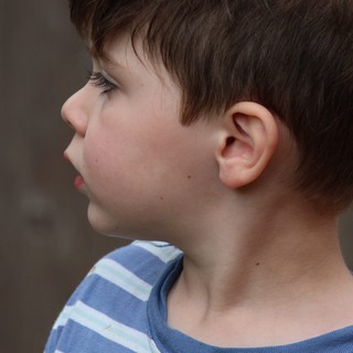 Young Boy in Blue Striped Shirt - Side Profile Portrait