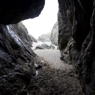 Looking Out Through a Sea Cave Opening to Beach
