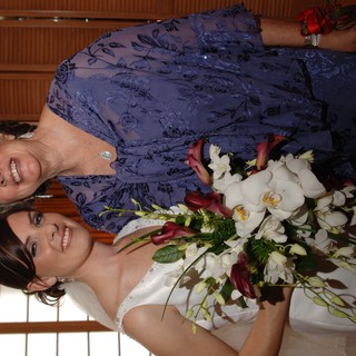Bride and Mother Share a Joyful Wedding Day Moment