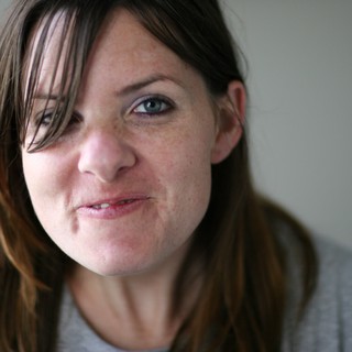 Candid Close-Up Portrait of a Young Woman Smiling