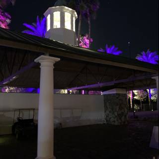 Illuminated Purple Clock Tower at the Empire Polo Club
