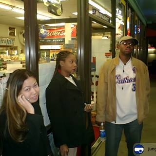 Three People Outside Convenience Store