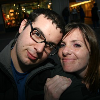 Couple Shares a Playful Moment on City Street
