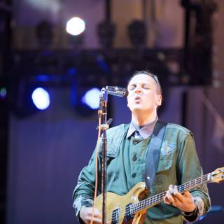 Win Butler Shines on Stage with His Guitar