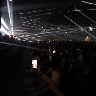 Massive Crowd Illuminated by Laser Light Show