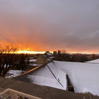 Sunset over Snowy Rooftop