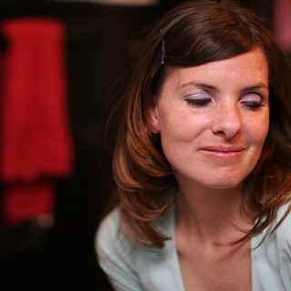 Contemplative Woman in Soft Indoor Light
