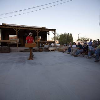 Ron English giving a speech in the desert