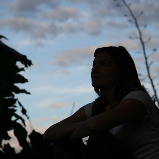 Silhouette of Woman Gazing at Twilight Sky