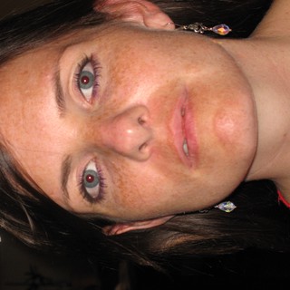 Freckled Woman in Red with Crystal Earrings