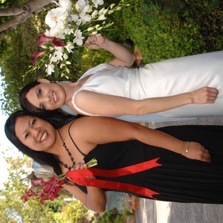 Bride and Bridesmaid Celebrate at Outdoor Wedding