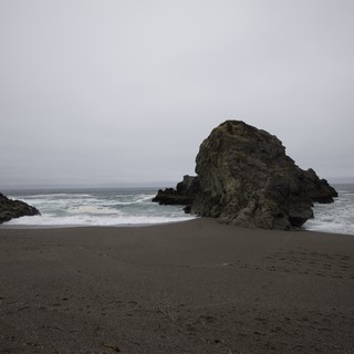 Moody Sea Stack on a Fog-Shrouded Northern California Beach