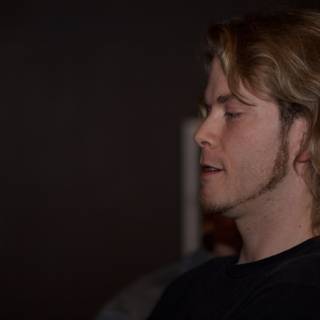 Long-haired Man in a T-Shirt