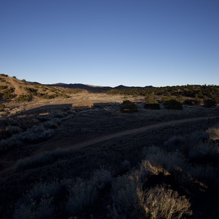 Desert Dirt Road at Dusk in Arid Southwest Landscape