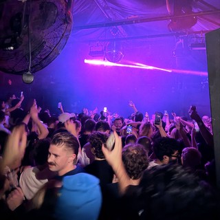 Purple-Lit Nightclub Crowd at London Venue