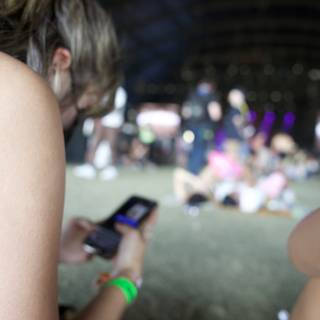 Connected in the Crowd: A Moment of Mobile Mingling at Coachella 2024
