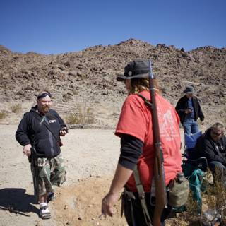 Red Shirt and Black Hat in the Desert
