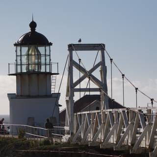 A Serene View of the White Bridge and Lighthouse