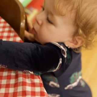 Toddler Making Phone Call at Christmas Gathering