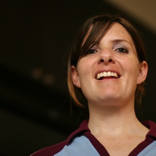 Joyful Woman Smiling Upward in Candid Portrait
