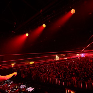 DJ Ignites Massive Crowd with Red Laser Light Show