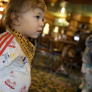 Young Child Admires Ornate Carousel at Madonna Inn