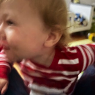 Young Child in Red Striped Shirt Close-Up Portrait
