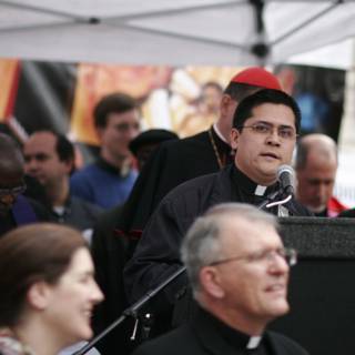 Priest Addresses Rally-Goers