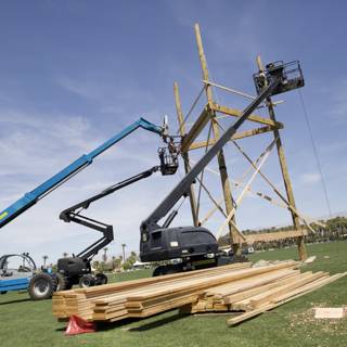 Wooden Construction Crane Lifts Lumber
