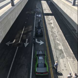 Green Car Parked Under Bridge in LA