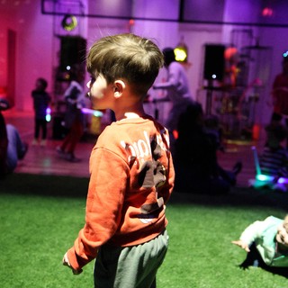 Child at Baby Rave Event in Museum Space